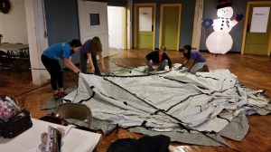 BHS Interact Club members putting up a ShelterBox tent in a fundraiser at Batesville's 2014 Holiday Parade event.