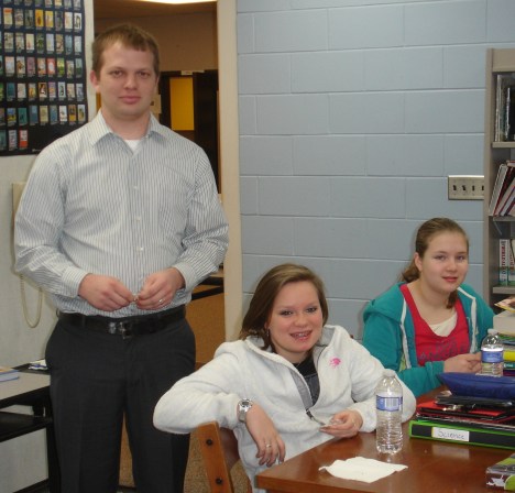 Rotarian Nick Kruthaupt distributes Interact pins